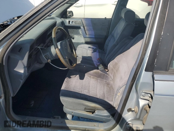 1989 Dodge Spirit z VIN 1B3BA46K1KF408949, wystawiony jako Copart lot #80767594 z przebiegiem 137 766 mil mil oraz Nie do naprawy. Historia ofert i sprzedaży dostępna na DreamBid. Obrazek 7.