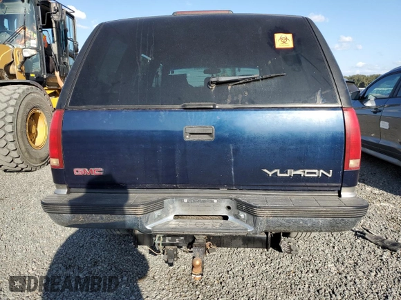 1998 GMC Yukon with VIN 1GKEK13R6WJ706204, listed as a Copart auction lot 77577074 with 186,023 mi miles and Salvage Title. Bid and sale history available at carsss.com. Image 6.