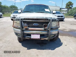 1999 Ford F-150 XL with VIN 2FTRX18L8XCB22793, listed as a IAAI auction lot 42016740 with 198,056 mi miles. Bid and sale history available at carsss.com. Image 6.
