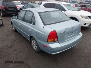 2003 Hyundai Accent GL with VIN KMHCG45C33U473080, listed as a IAAI auction lot 41868765 with 57,478 mi miles. Bid and sale history available at carsss.com. Image 3.