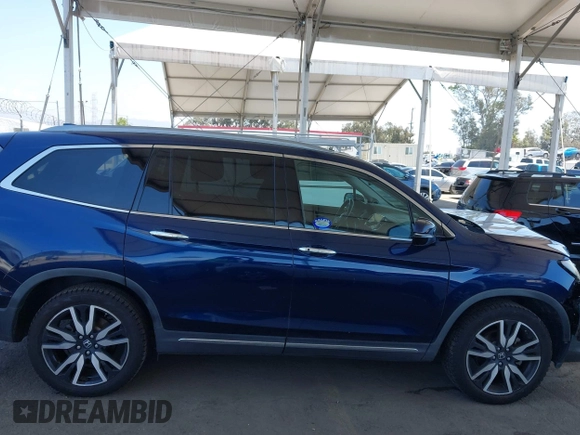 2019 Honda Pilot Touring 8-Passenger z VIN 5FNYF5H97KB013530, wystawiony jako IAAI lot #42403449 z przebiegiem 90 557 mil mil oraz . Historia ofert i sprzedaży dostępna na DreamBid. Obrazek 13.