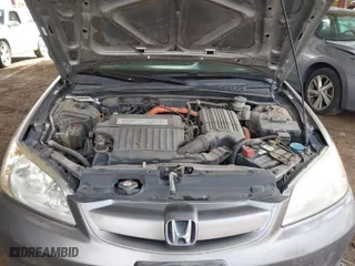 2004 Honda Civic Hybrid with VIN JHMES95654S018200, listed as a IAAI auction lot 41912912 with 291,301 mi miles. Bid and sale history available at carsss.com. Image 10.