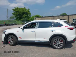 2020 Mazda CX-9 Grand Touring with VIN JM3TCBDY3L0410674, listed as a IAAI auction lot 42389157 with 130,519 mi miles and . Bid and sale history available at DreamBid. Image 14.