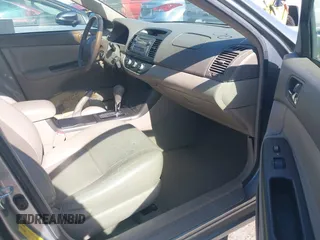 2005 Toyota Camry LE z VIN 4T1BE30K65U592500, wystawiony jako IAAI lot #42373718 z przebiegiem 189 054 mil mil oraz . Historia ofert i sprzedaży dostępna na DreamBid. Obrazek 5.