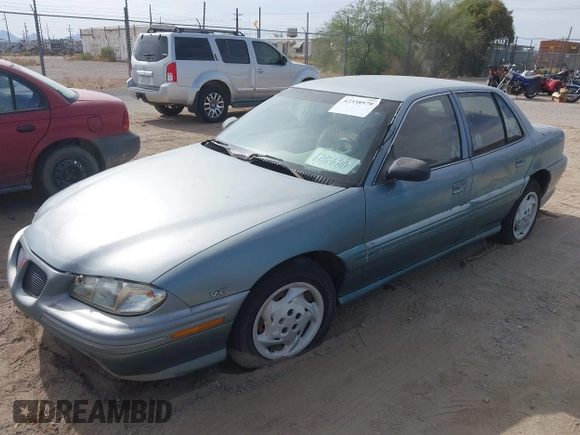 1996 Pontiac Grand Am SE with VIN 1G2NE52M8TC810732, listed as a IAAI auction lot 42338979 with 107,027 mi miles and . Bid and sale history available at DreamBid. Image 2.