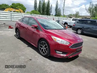 2015 Ford Focus SE z VIN 1FADP3F24FL332883, wystawiony jako Copart lot #64429655 z przebiegiem 65 939 mil mil oraz Szkoda całkowita • Salvage title. Historia ofert i sprzedaży dostępna na DreamBid. Obrazek 13.