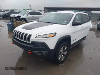 2015 Jeep Cherokee Trailhawk with VIN 1C4PJMBB1FW630519, listed as a IAAI auction lot 41605466 with 219,390 mi miles and . Bid and sale history available at carsss.com. Image 2.