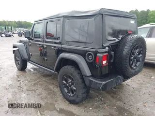 2021 Jeep Wrangler Unlimited Sport S with VIN 1C4HJXDN0MW678801, listed as a IAAI auction lot 42211815 with 96,849 mi miles and . Bid and sale history available at DreamBid. Image 3.