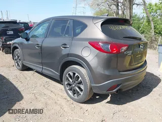 2016 Mazda CX-5 Grand Touring z VIN JM3KE4DY8G0846265, wystawiony jako IAAI lot #42102843 z przebiegiem 159 827 mil mil oraz . Historia ofert i sprzedaży dostępna na DreamBid. Obrazek 3.
