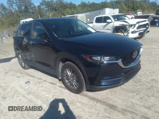 2020 Mazda CX-5 Touring with VIN JM3KFACM1L1817303, listed as a IAAI auction lot 41627859 with 57,268 mi miles. Bid and sale history available at carsss.com. Image 1.