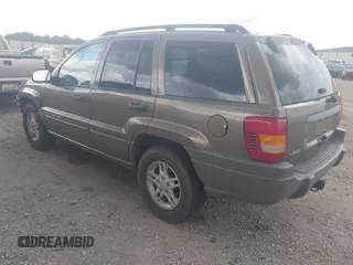 2002 Jeep Grand Cherokee Laredo with VIN 1J4GX48S32C168105, listed as a IAAI auction lot 42451373 with 293,790 mi miles and . Bid and sale history available at DreamBid. Image 3.