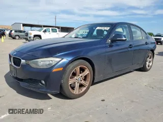 2015 BMW 3 Series 320i with VIN WBA3B1C58FK140327, listed as a Copart auction lot 57999675 with 124,437 mi miles and Salvage title. Bid and sale history available at DreamBid. Image 1.