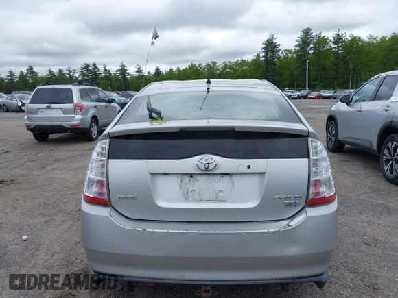 2006 Toyota Prius z VIN JTDKB20U967074471, wystawiony jako IAAI lot #42332013 z przebiegiem 303 162 mil mil oraz . Historia ofert i sprzedaży dostępna na DreamBid. Obrazek 14.