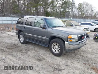 2002 GMC Yukon SLT with VIN 1GKEC13ZX2J217778, listed as a IAAI auction lot 41469912 with 293,497 mi miles. Bid and sale history available at carsss.com. Image 1.