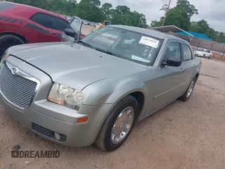 2006 Chrysler 300 Touring with VIN 2C3KA53G06H164188, listed as a IAAI auction lot 42079830 with 165,321 mi miles. Bid and sale history available at carsss.com. Image 2.