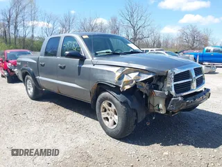 2006 Dodge Dakota SLT z VIN 1D7HW48KX6S547519, wystawiony jako IAAI lot #41971182 z przebiegiem 205 859 mil mil oraz . Historia ofert i sprzedaży dostępna na DreamBid. Obrazek 1.
