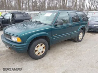 1997 Oldsmobile Bravada with VIN 1GHDT13W2V2706505, listed as a IAAI auction lot 41835475 with 131,247 mi miles. Bid and sale history available at carsss.com. Image 2.