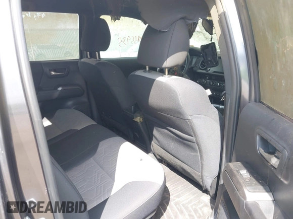 2023 Toyota Tacoma SR with VIN 3TMCZ5AN0PM636306, listed as a IAAI auction lot 42255935 with 14,131 mi miles and . Bid and sale history available at DreamBid. Image 8.