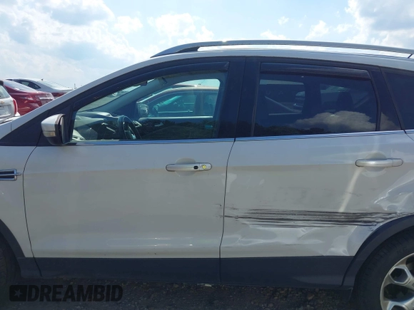 2015 Ford Escape Titanium with VIN 1FMCU9J90FUA05005, listed as a IAAI auction lot 42501764 with 121,993 mi miles and . Bid and sale history available at DreamBid. Image 14.