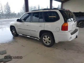 2003 GMC Envoy SLE with VIN 1GKDT13SX32319740, listed as a IAAI auction lot 41923578 with 210,811 mi miles. Bid and sale history available at carsss.com. Image 3.