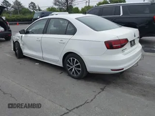 2016 Volkswagen Jetta Sedan 1.4T SE with VIN 3VWD67AJ6GM260584, listed as a IAAI auction lot 41903048 with 104,876 mi miles. Bid and sale history available at carsss.com. Image 3.