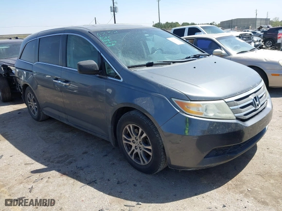 2012 Honda Odyssey EX-L with VIN 5FNRL5H64CB131197, listed as a IAAI auction lot 41829107 with 215,115 mi miles. Bid and sale history available at carsss.com. Image 1.