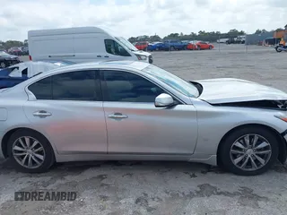 2014 Infiniti Q50 Premium z VIN JN1BV7AP9EM690381, wystawiony jako IAAI lot #41761562 z przebiegiem 107 099 mil mil oraz . Historia ofert i sprzedaży dostępna na DreamBid. Obrazek 13.