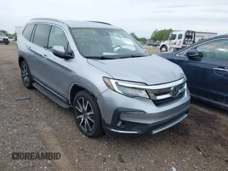 2019 Honda Pilot Elite z VIN 5FNYF6H01KB000991, wystawiony jako IAAI lot #42301704 z przebiegiem 104 155 mil mil oraz . Historia ofert i sprzedaży dostępna na DreamBid. Obrazek 1.