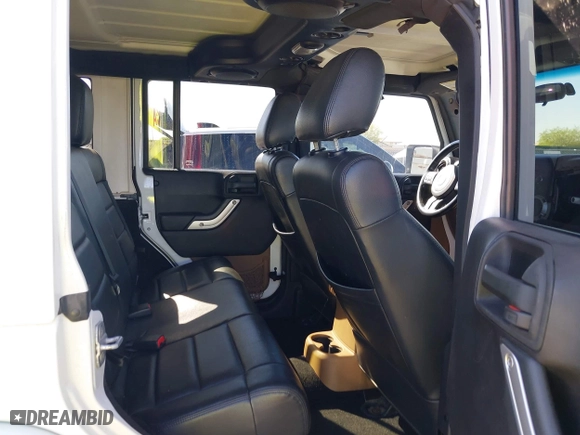 2012 Jeep Wrangler Unlimited Sahara with VIN 1C4BJWEG2CL117080, listed as a IAAI auction lot 41868590 with 92,475 mi miles. Bid and sale history available at carsss.com. Image 8.