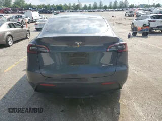 2023 Tesla Model Y Long Range z VIN 7SAYGDEE2PA041350, wystawiony jako Copart lot #56657005 z przebiegiem 25 090 mil mil oraz Szkoda całkowita • Salvage title. Historia ofert i sprzedaży dostępna na DreamBid. Obrazek 6.