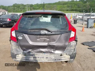 2015 Honda Fit LX with VIN 3HGGK5H58FM722880, listed as a IAAI auction lot 42276261 with 104,886 mi miles and . Bid and sale history available at DreamBid. Image 16.