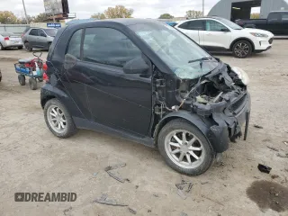 2009 Smart fortwo Pure with VIN WMEEJ31X19K267800, listed as a Copart auction lot 77392744 with 100,178 mi miles and Salvage Title. Bid and sale history available at carsss.com. Image 4.