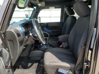 2018 Jeep Wrangler JK Unlimited Sport S with VIN 1C4BJWDG3JL899209, listed as a Copart auction lot 67705634 with 100,679 mi miles and Salvage Title. Bid and sale history available at carsss.com. Image 7.