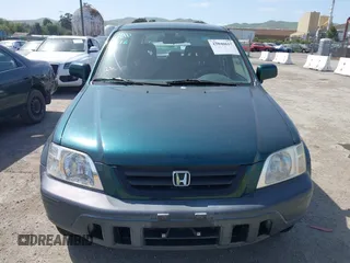 1999 Honda CR-V EX with VIN JHLRD1866XC028200, listed as a IAAI auction lot 42040657 with 207,397 mi miles. Bid and sale history available at carsss.com. Image 6.