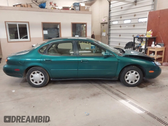 1996 Ford Taurus GL z VIN 1FALP52U5TG110582, wystawiony jako IAAI lot #40858639 z przebiegiem 57 965 mil mil oraz . Historia ofert i sprzedaży dostępna na DreamBid. Obrazek 13.