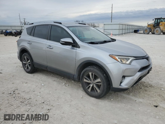 2018 Toyota RAV4 XLE with VIN JTMWFREV3JJ180152, listed as a Copart auction lot 46949465 with 103,346 mi miles and Clean Title. Bid and sale history available at DreamBid. Image 4.