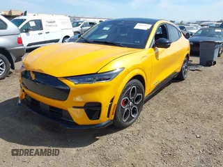 2023 Ford Mustang Mach-E GT z VIN 3FMTK4SE9PMA37249, wystawiony jako IAAI lot #41895122 z przebiegiem 25 614 mil mil oraz . Historia ofert i sprzedaży dostępna na DreamBid. Obrazek 2.
