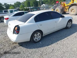 2002 Nissan Altima SL z VIN 1N4AL11DX2C279807, wystawiony jako IAAI lot #42482548 z przebiegiem 208 233 mil mil oraz . Historia ofert i sprzedaży dostępna na DreamBid. Obrazek 4.