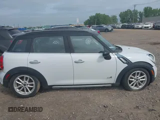 2015 MINI Countryman S with VIN WMWZC5C59FWM18935, listed as a IAAI auction lot 42427878 with 121,410 mi miles and . Bid and sale history available at DreamBid. Image 13.