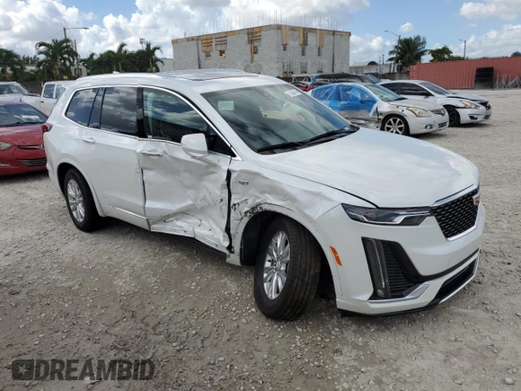 2024 Cadillac XT6 FWD Luxury with VIN 1GYKPAR4XRZ746989, listed as a Copart auction lot 77325614 with 2,234 mi miles and Salvage Title. Bid and sale history available at carsss.com. Image 4.