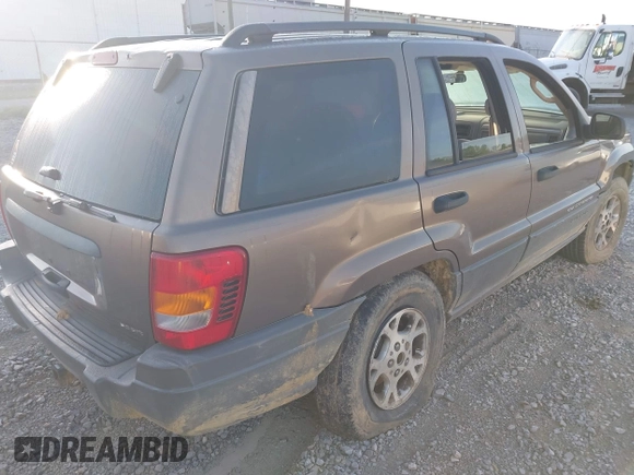 2002 Jeep Grand Cherokee with VIN 1J4GW38N42C202219, listed as a IAAI auction lot 42035162 with 220,012 mi miles and . Bid and sale history available at DreamBid. Image 4.