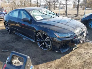 2021 Audi RS 7 z VIN WUAPCBF23MN903930, wystawiony jako IAAI lot #41669778 z przebiegiem 13 175 mil mil oraz . Historia ofert i sprzedaży dostępna na DreamBid. Obrazek 1.