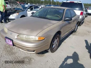 2004 Oldsmobile Alero GL1 z VIN 1G3NL52F14C137772, wystawiony jako IAAI lot #41850374 z przebiegiem 216 956 mil mil oraz . Historia ofert i sprzedaży dostępna na DreamBid. Obrazek 2.