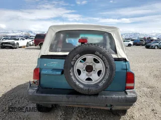 1996 Chevrolet Tracker z VIN 2CNBJ1869T6903615, wystawiony jako Copart lot #49690055 z przebiegiem 144 821 mil mil oraz Szkoda całkowita • Salvage title. Historia ofert i sprzedaży dostępna na DreamBid. Obrazek 6.