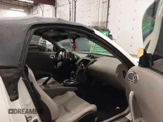 2005 Nissan 350Z Touring with VIN JN1AZ36A45M754923, listed as a IAAI auction lot 41720671 with 124,916 mi miles. Bid and sale history available at carsss.com. Image 5.