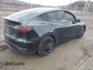 2024 Tesla Model Y Performance with VIN 7SAYGDEF7RF020203, listed as a IAAI auction lot 41639077 with 14,493 mi miles and . Bid and sale history available at DreamBid. Image 4.