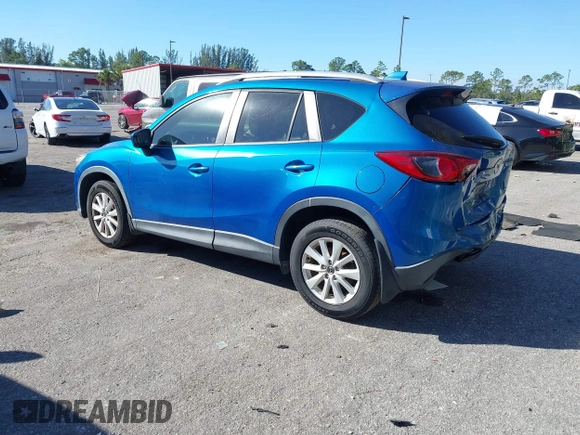 2014 Mazda CX-5 Touring with VIN JM3KE2CYXE0310873, listed as a IAAI auction lot 41309633 with 175,325 mi miles and . Bid and sale history available at DreamBid. Image 3.