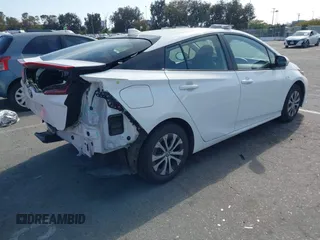 2021 Toyota Prius LE with VIN JTDKAMFP7M3197111, listed as a IAAI auction lot 42031569 with 240,098 mi miles and . Bid and sale history available at DreamBid. Image 4.