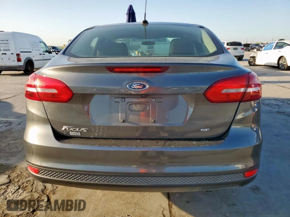 2018 Ford Focus SE z VIN 1FADP3F2XJL256272, wystawiony jako Copart lot #52651675 z przebiegiem 37 897 mil mil oraz Szkody całkowita. Historia ofert i sprzedaży dostępna na DreamBid. Obrazek 6.