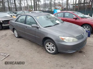 2004 Toyota Camry LE with VIN 4T1BF30K54U581984, listed as a IAAI auction lot 41790996 with 256,009 mi miles. Bid and sale history available at carsss.com. Image 1.